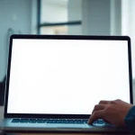 Atera login screen being accessed on a laptop in a bright workspace.